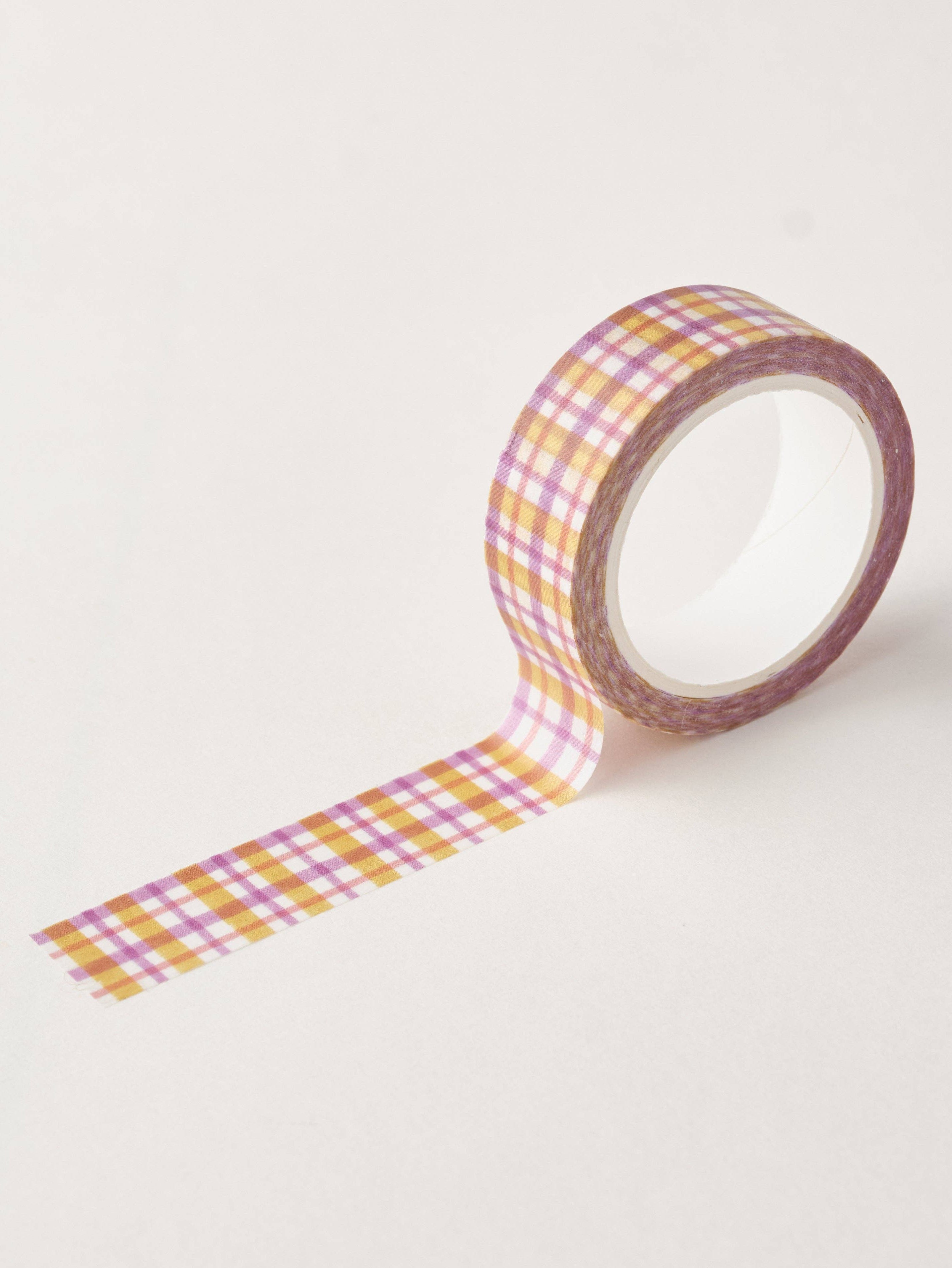 Checkered tape with pink and yellow pattern on a light gray background