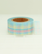 A roll of pastel plaid washi tape with light blue, pink, and yellow stripes, displayed on a clean white surface with a soft reflection.